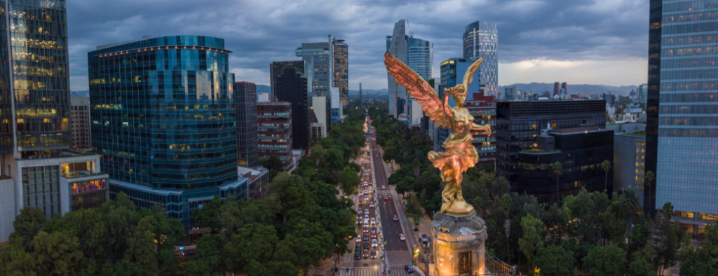 Sky scape of a city in Mexico - golden statue