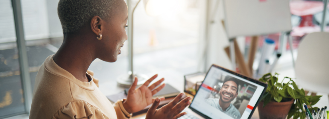 a professional woman speaking during a virtual meeting