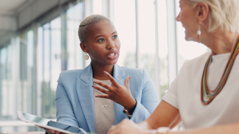 team members having a conversation at the office