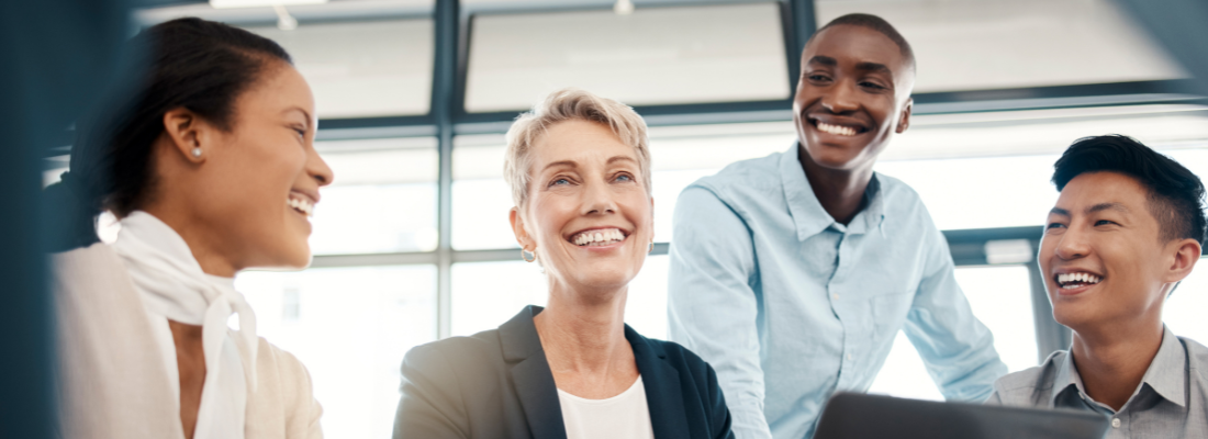 a team of professionals smiling together in a business environment