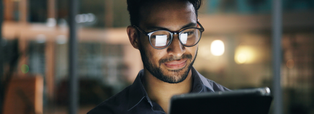 a professional man reading a tablet