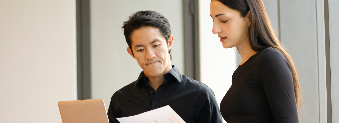 Two global professionals collaborating during a business meeting